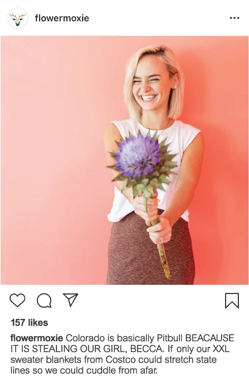 Instagram image of a smiling woman holding flowers