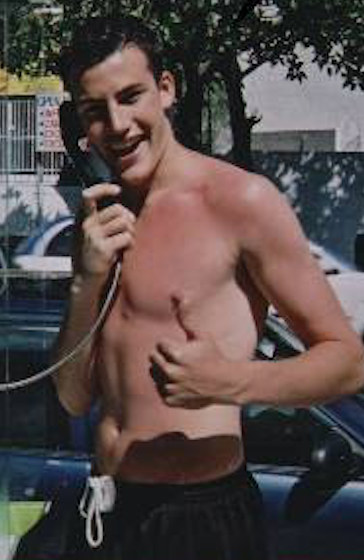 Mark Moran shirtless and talking on a phone